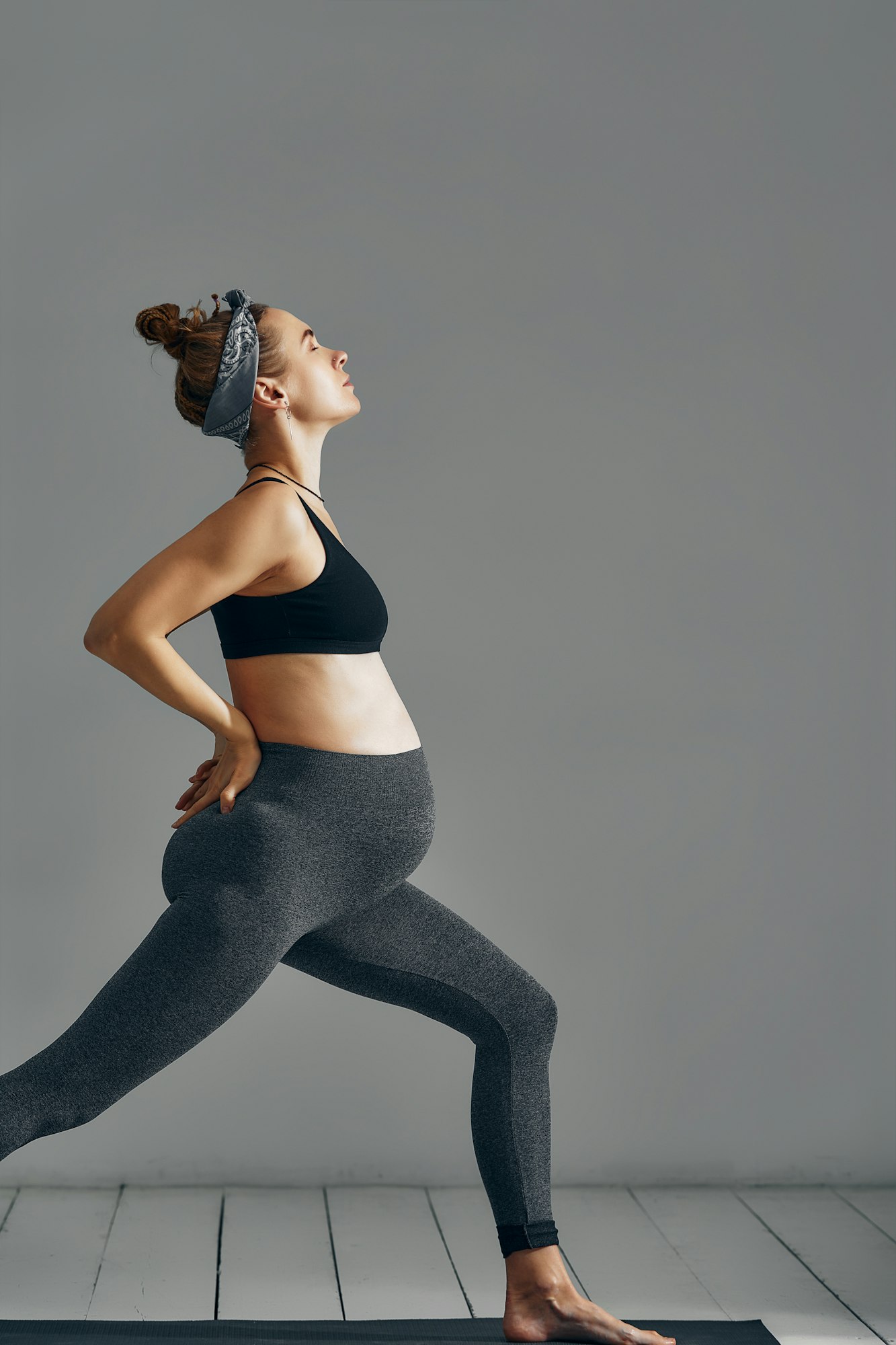 Beautiful pregnant woman workout. Doing fitness on last months of pregnancy. Yoga positions.